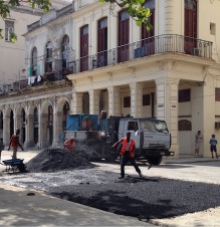 spreading asphalt in Cuba