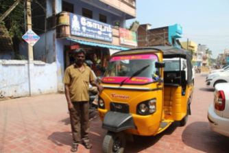 Pink and orange auto rickshaw