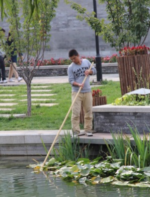 Cleaning a pond, China
