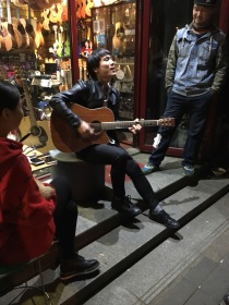 Playing a guitar, China