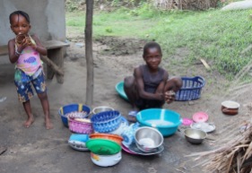 Washing dishes, Byama, Sierra Leone